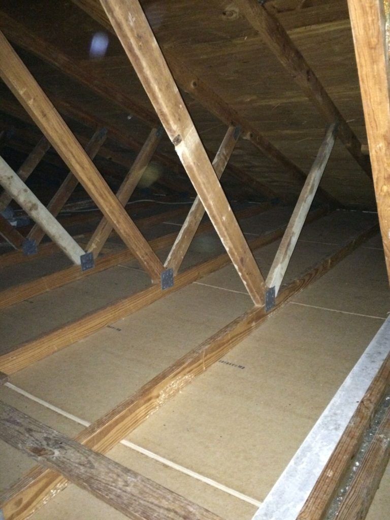 Wooden attic rafters and braces.