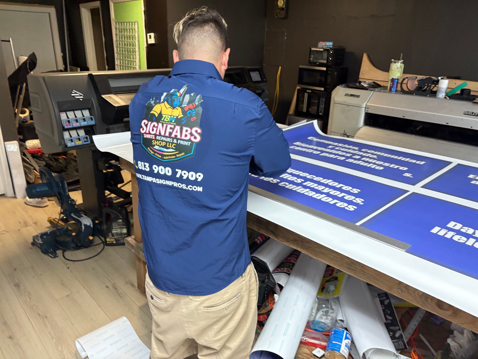 Storefront: Custom Decals & Signage, with a city skyline graphic on the door.