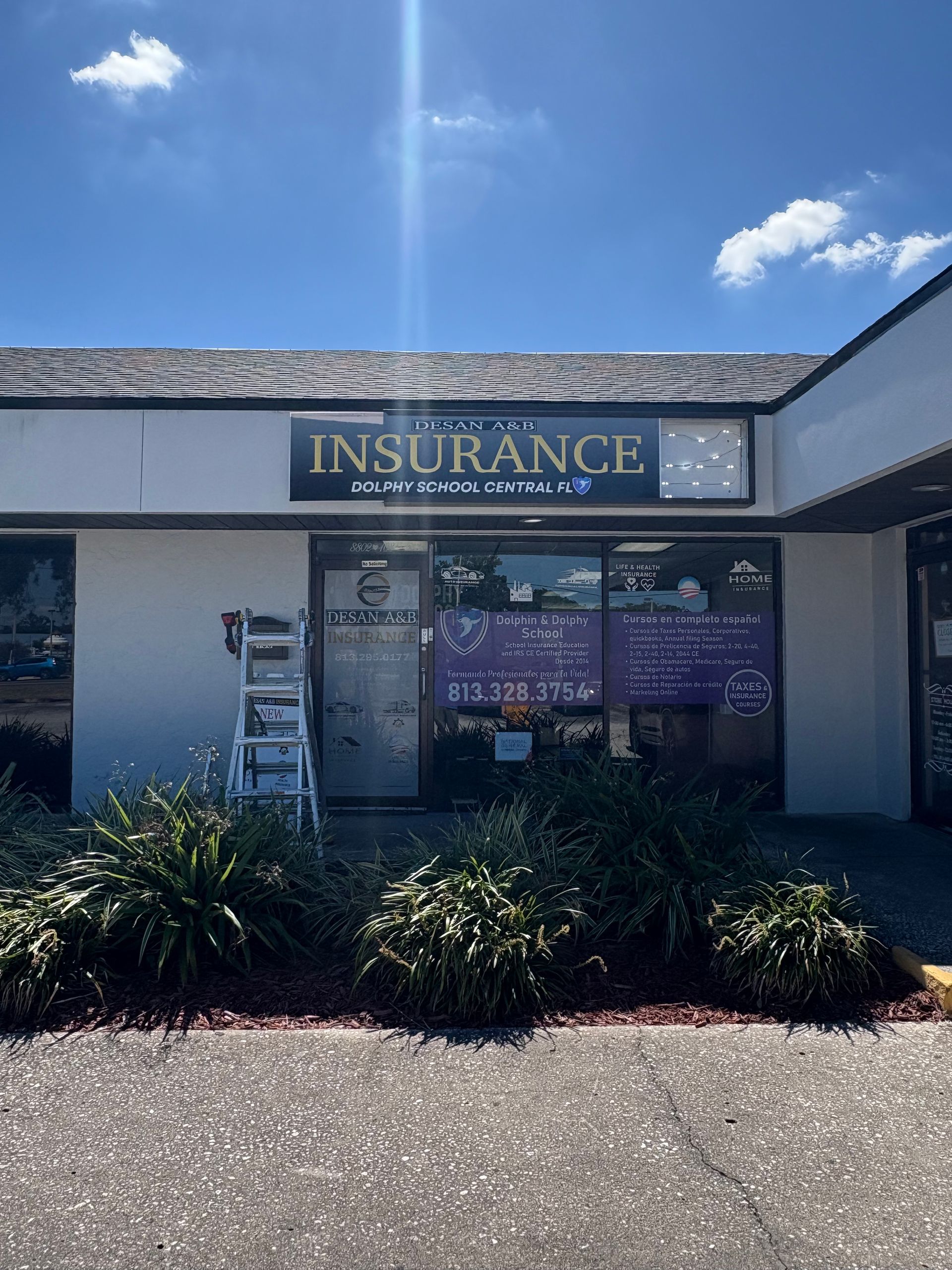 Exterior of an insurance office with signage 