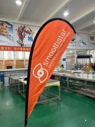 Orange teardrop flag with white 