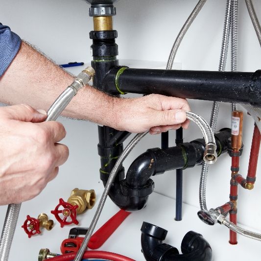 Performing plumbing services