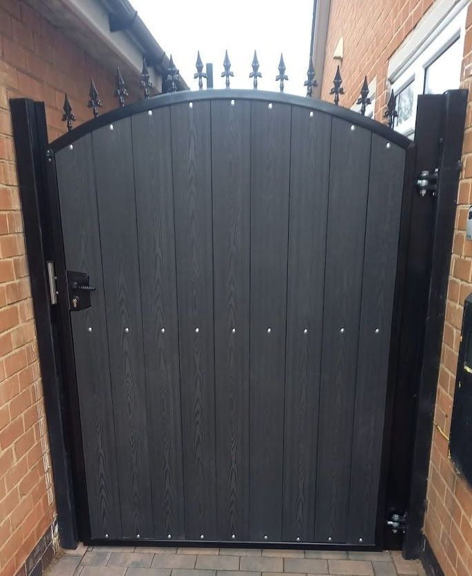 Composite Gates UK showing a pedestrian composite gate with an arched top