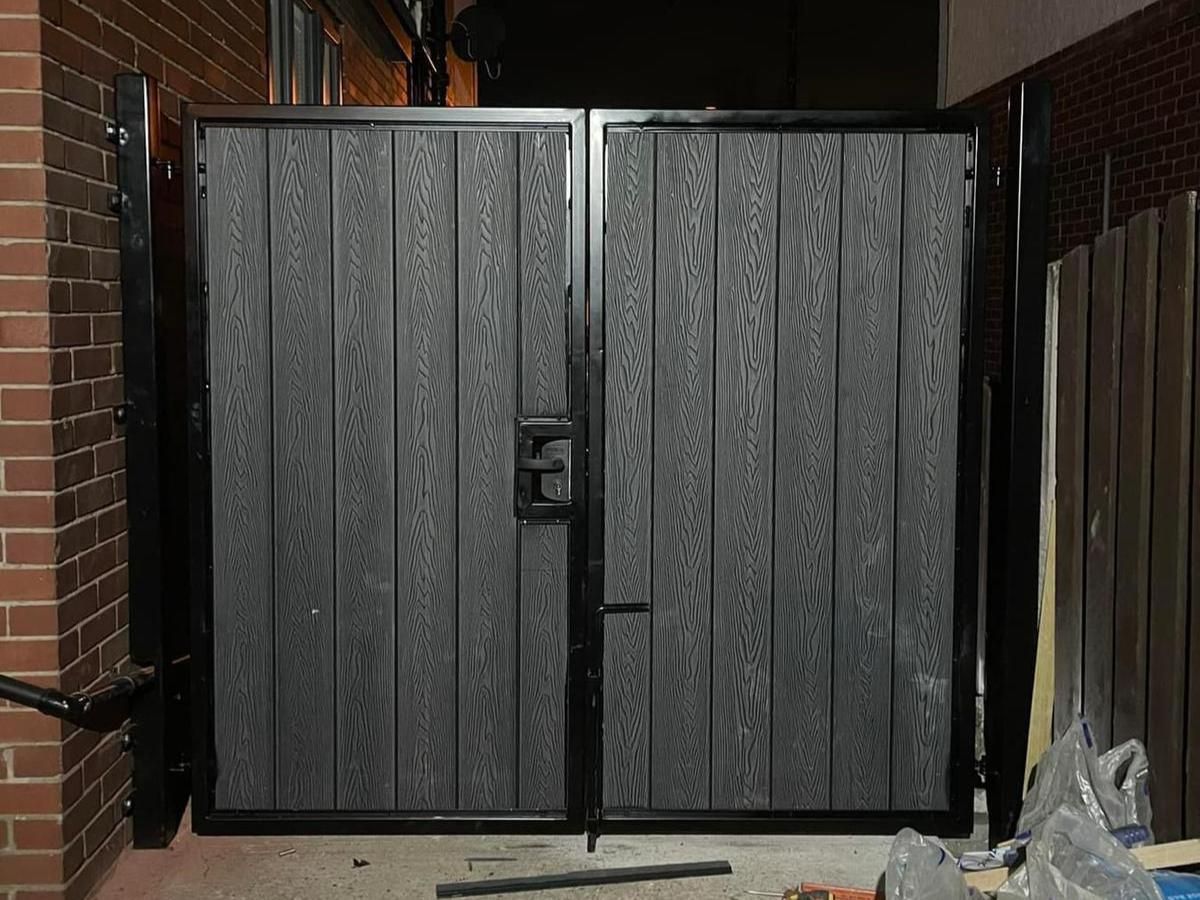 Grey composite driveway gates with