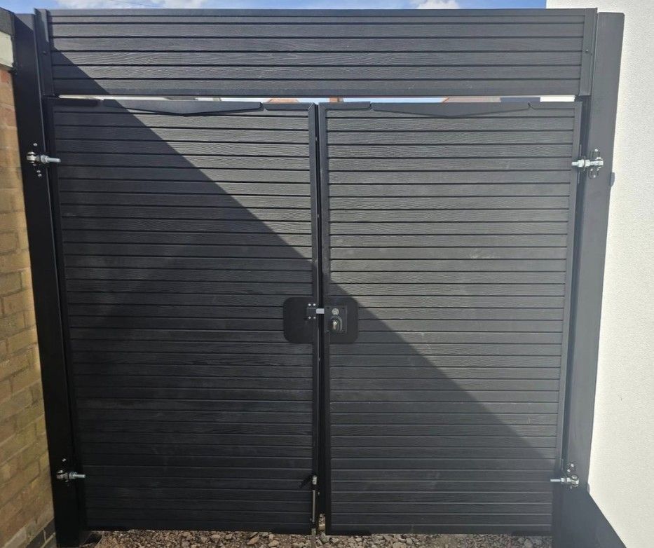 Arched Grey Composite Driveway Gates with Additional Top Panel in Blackpool