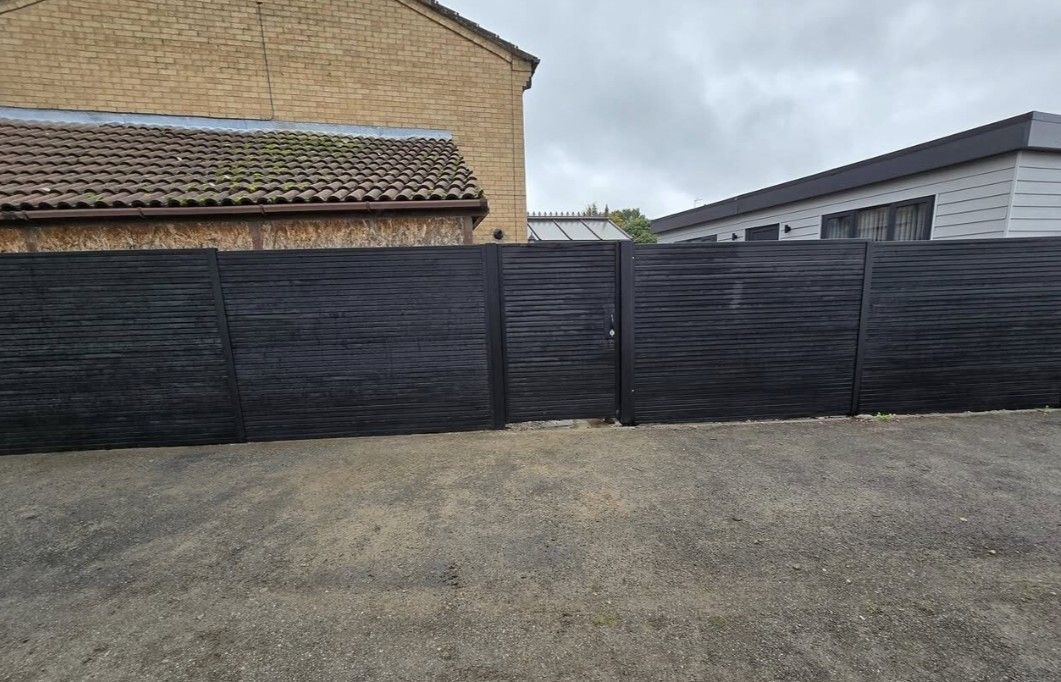 Composite Gates UK Multiple bay natural timber composite fencing installation in Derby