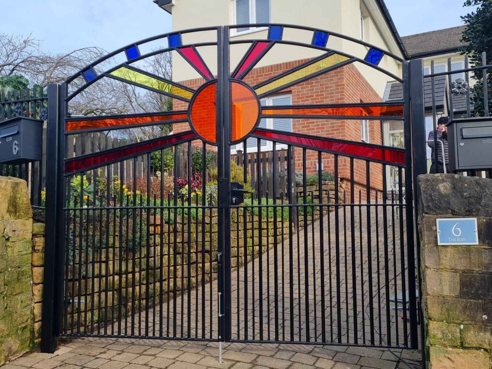 Composite Gates UK arched metal driveway with Perspex infills