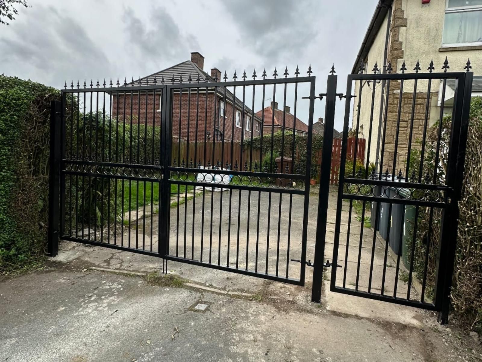 Composite Gates UK metal driveway gates & pedestrian gate with fleur de lis top with additional pedestrian gate