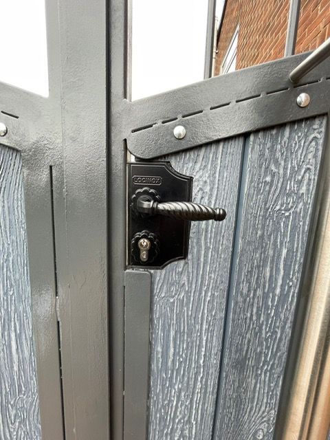 close up of lock fitted to composite driveway gates