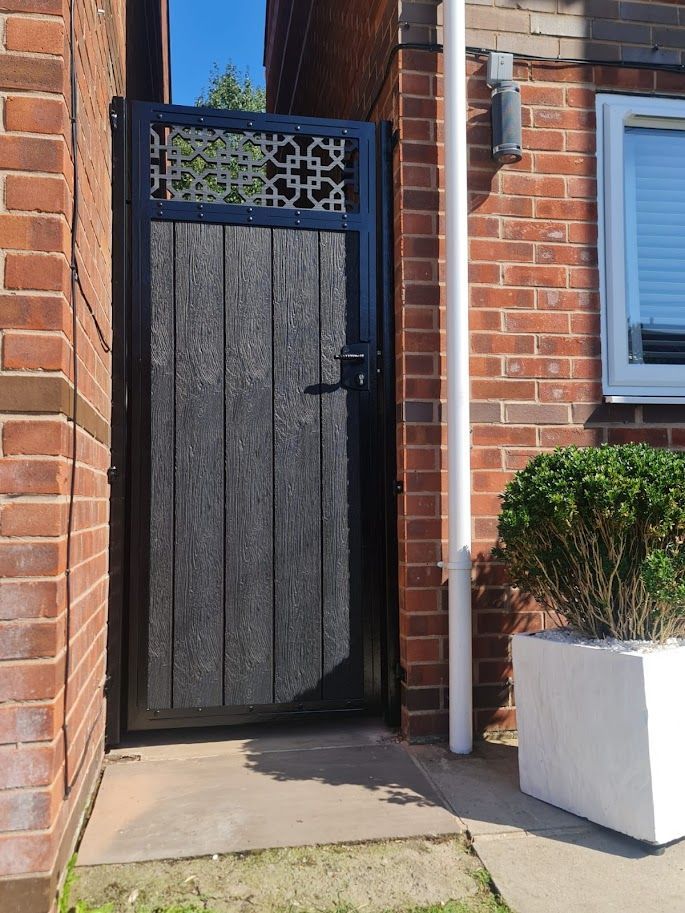grey composite garden gate with screen topper in Wetherby