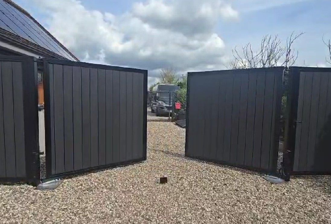Double electric composite swing gates installed in Basingstoke