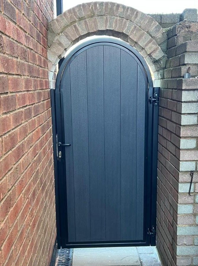 grey composite back gate with infill composite panel installed in Portslade