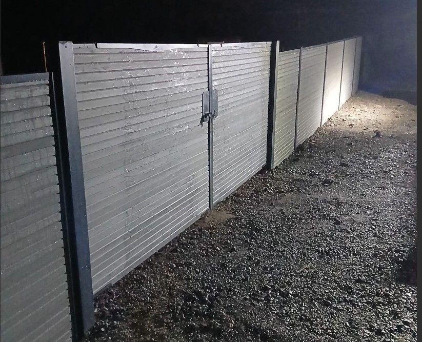 Double Composite Driveway Gates Installed Between Matching Composite Fencing in Blackpool