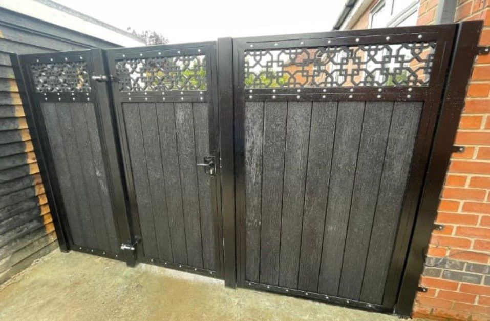 grey composite back gate with infill composite panel installed in Wellingborough
