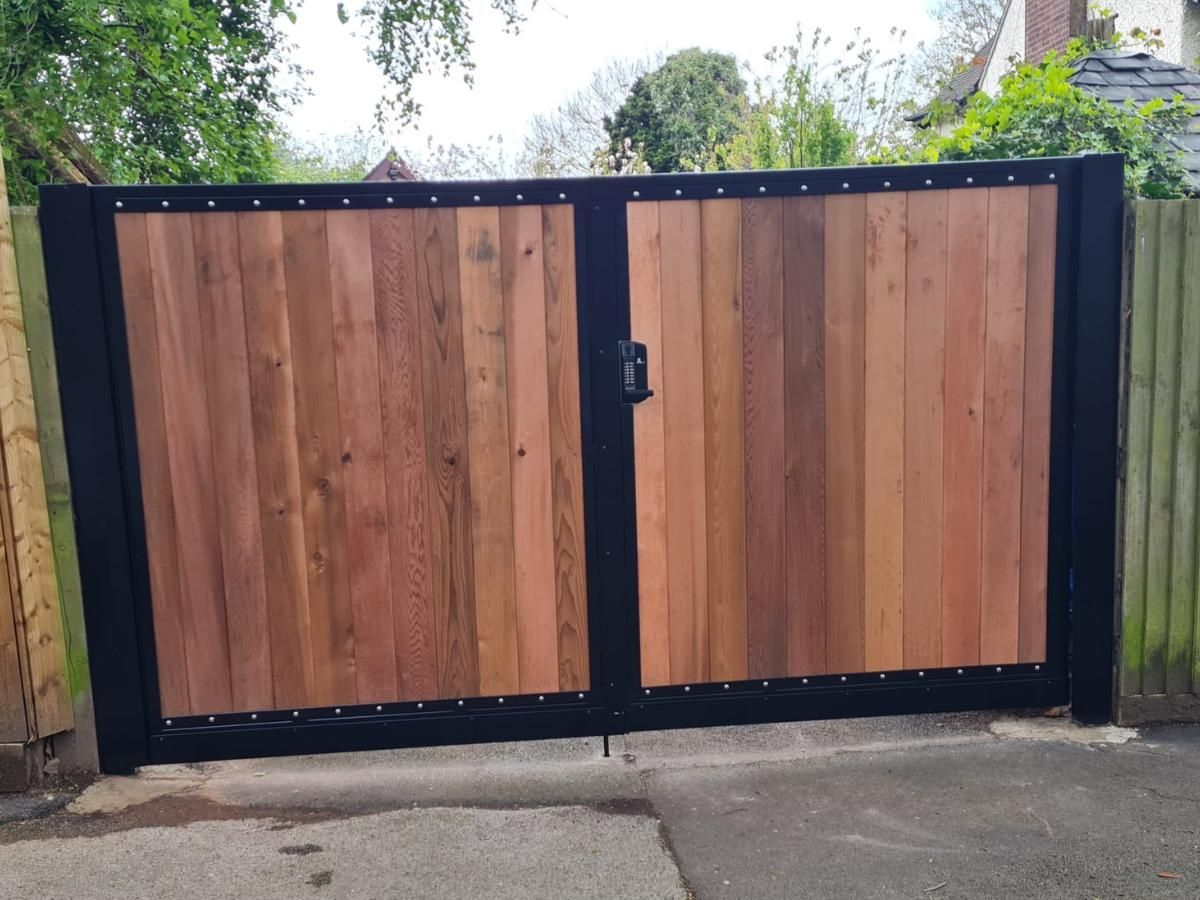 Composite Gates UK inside view of metal framed wooden driveway gates with keypad lock