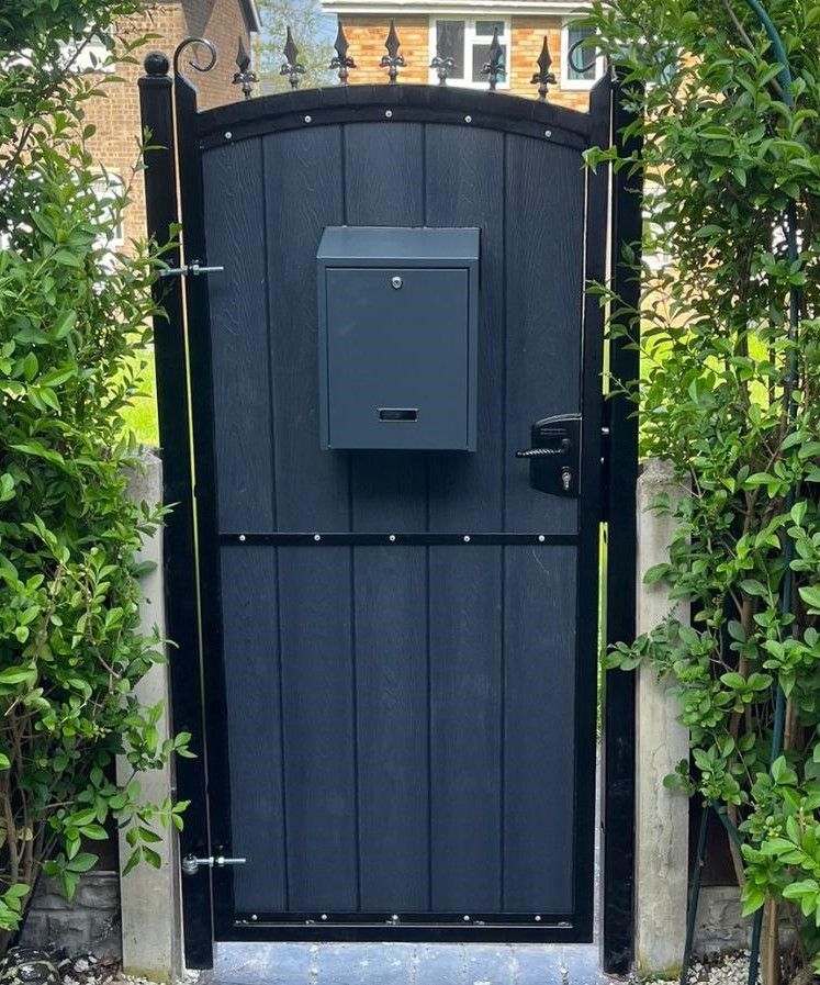 Arched composite pedestrian gate with fleur de lis finials and letterbox installed in Birkenhead