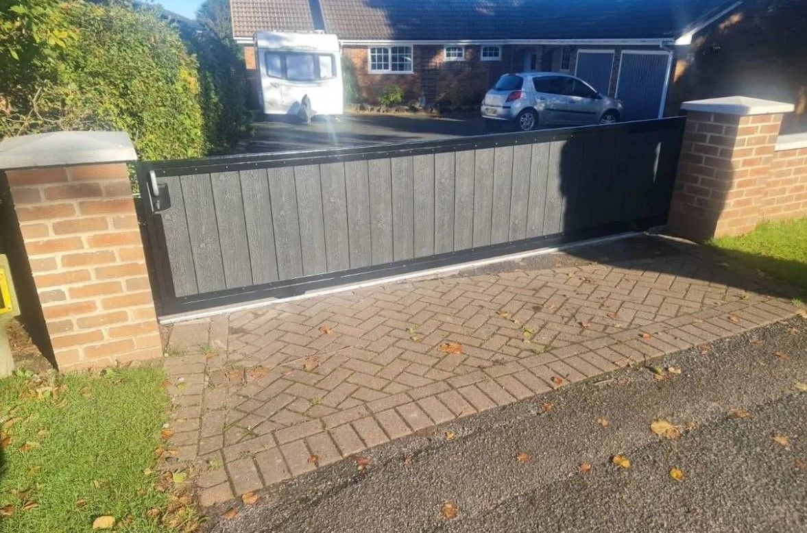 3 foot high sliding composite driveway gate fitted ready for automation