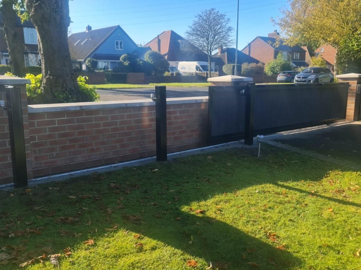 Composite Gates UK single sliding composite driveway gate showing inside rail and supports