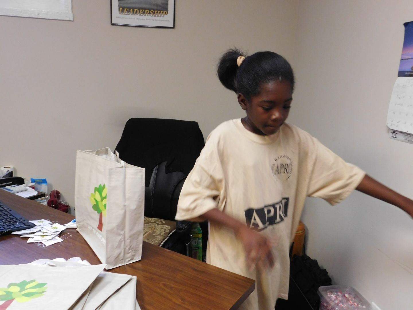 Youth in an APRI shirt