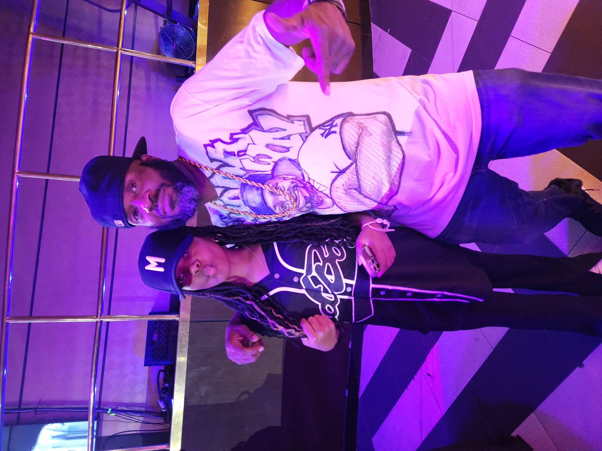  Al Brown poses with a friend as he sports his custom made t-shirt by Big Bri, at an APRI 