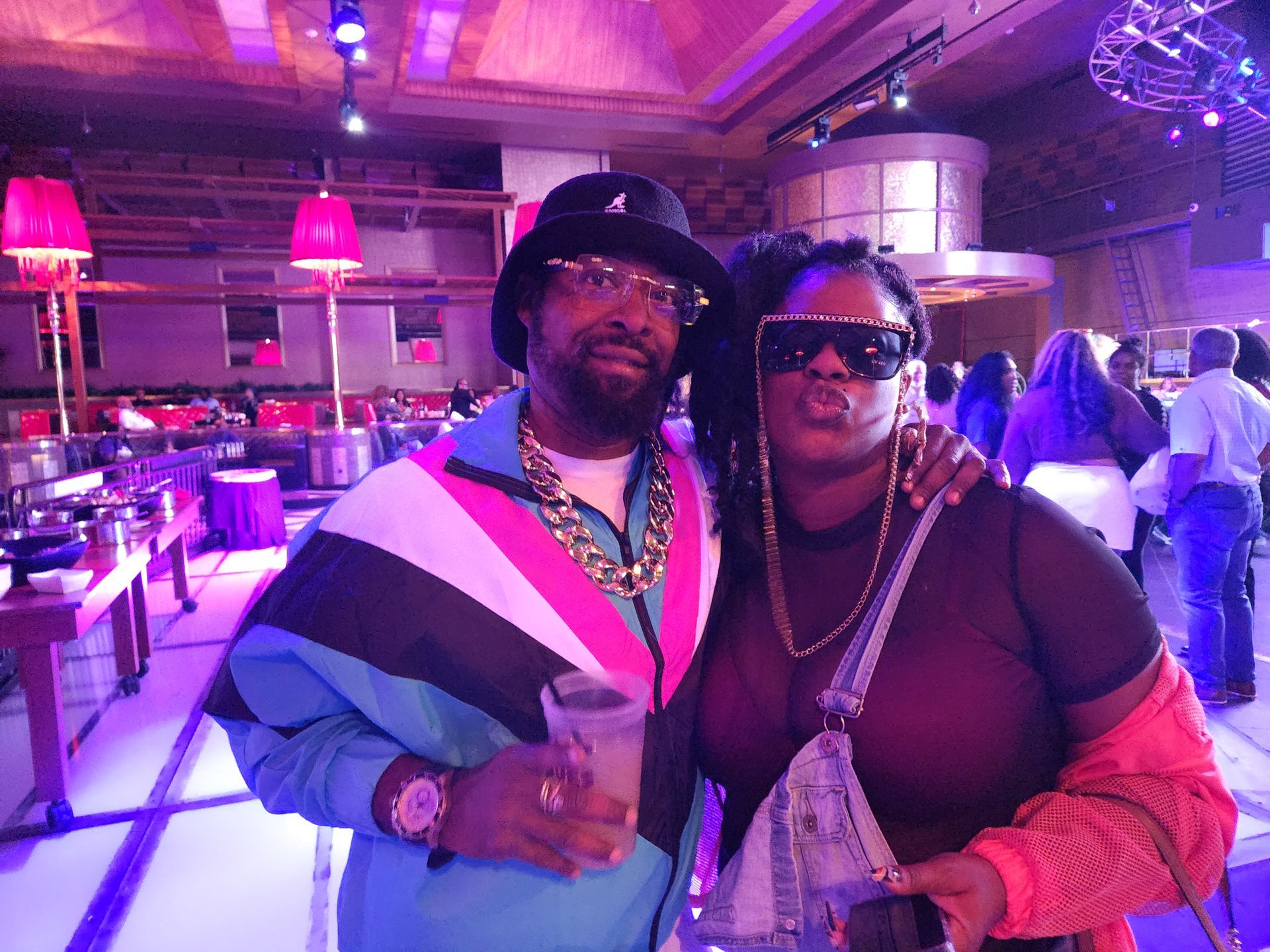 A man and a woman are posing for a picture at an APRI 