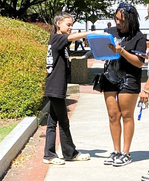 Voter registration volunteer in North Carolina helps a citizen sign up to vote