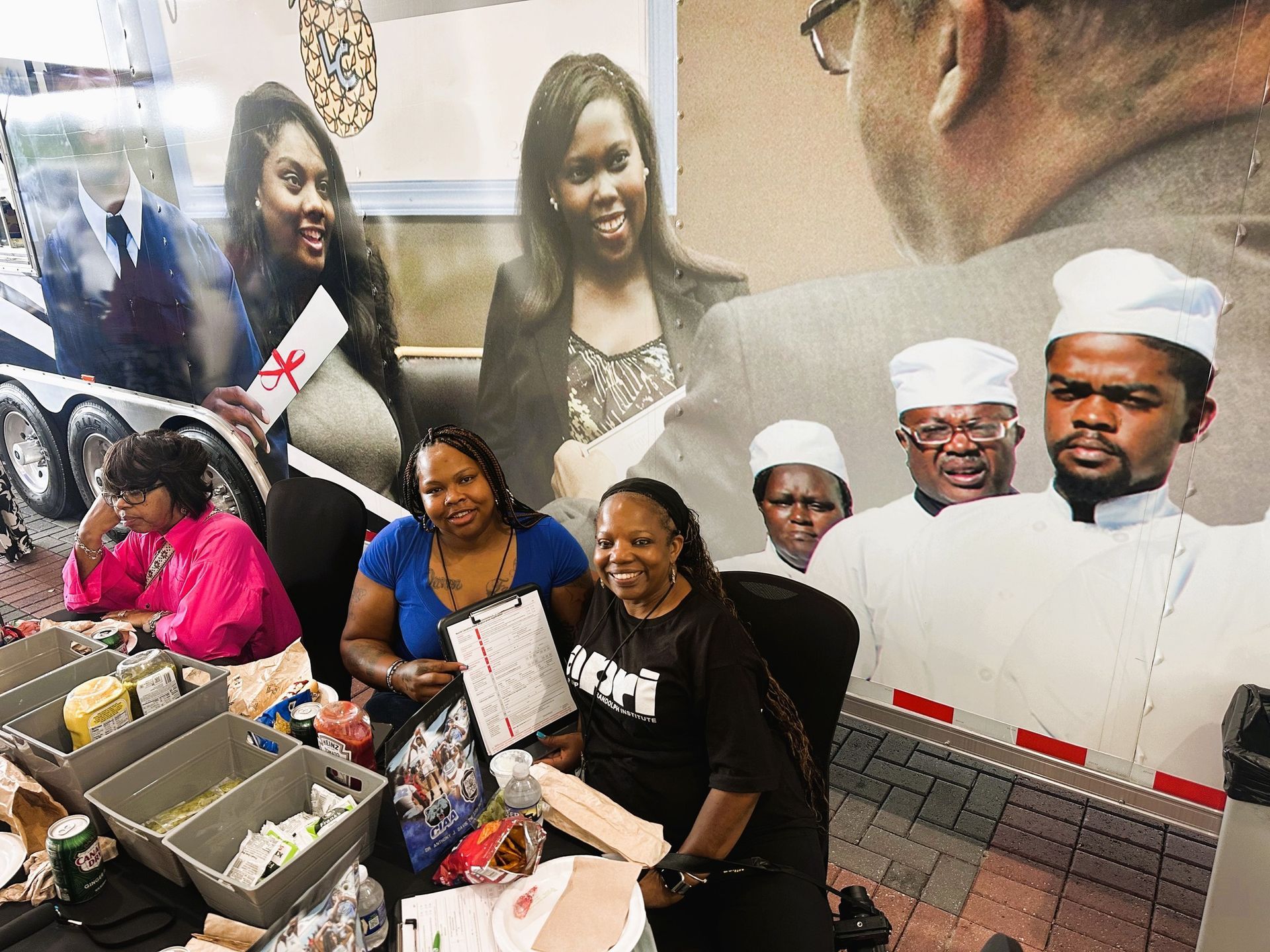 Voter registration volunteers in North Carolina next to a mural