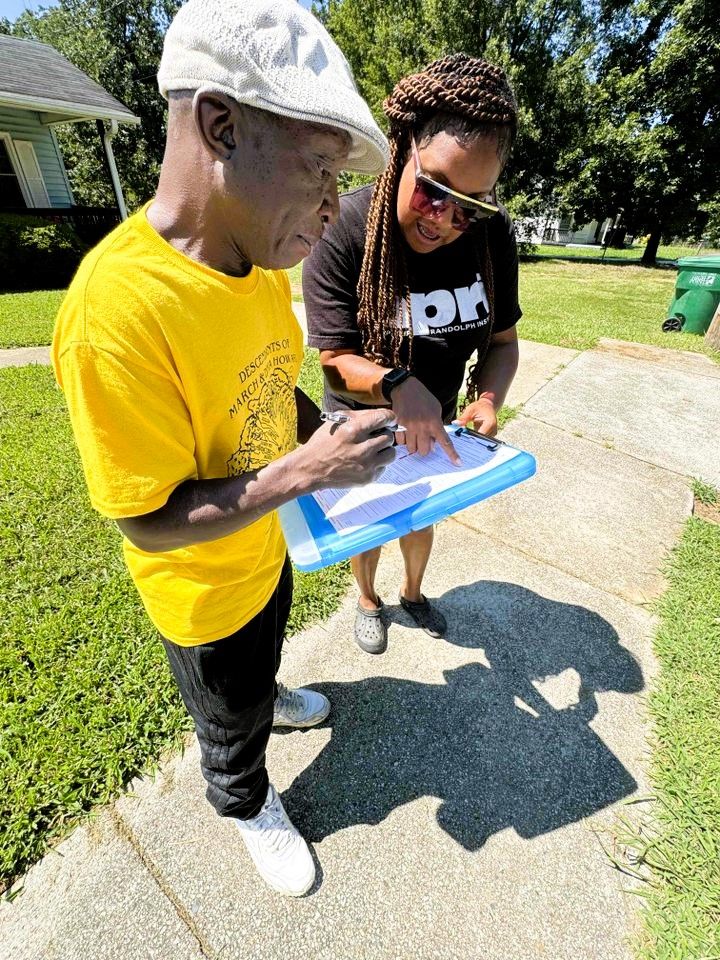 Voter registration volunteer in a yellow shirt in North Carolina