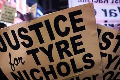 A sign that says justice for tyre nichols