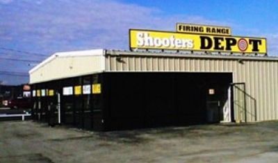 A shooters depot building with a yellow sign above it