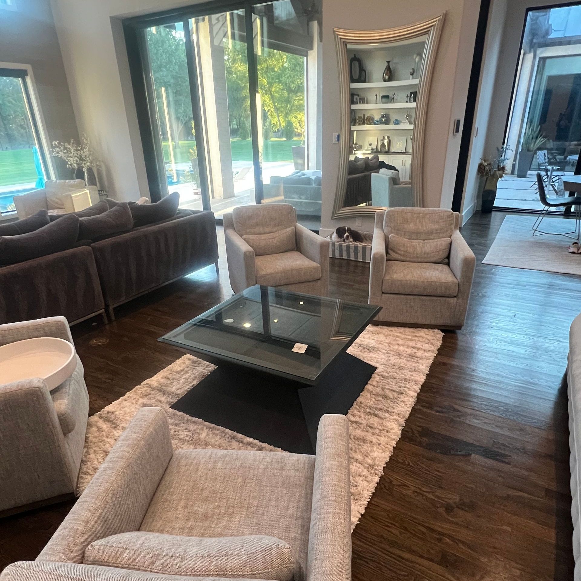 A living room with a couch and chairs and a coffee table