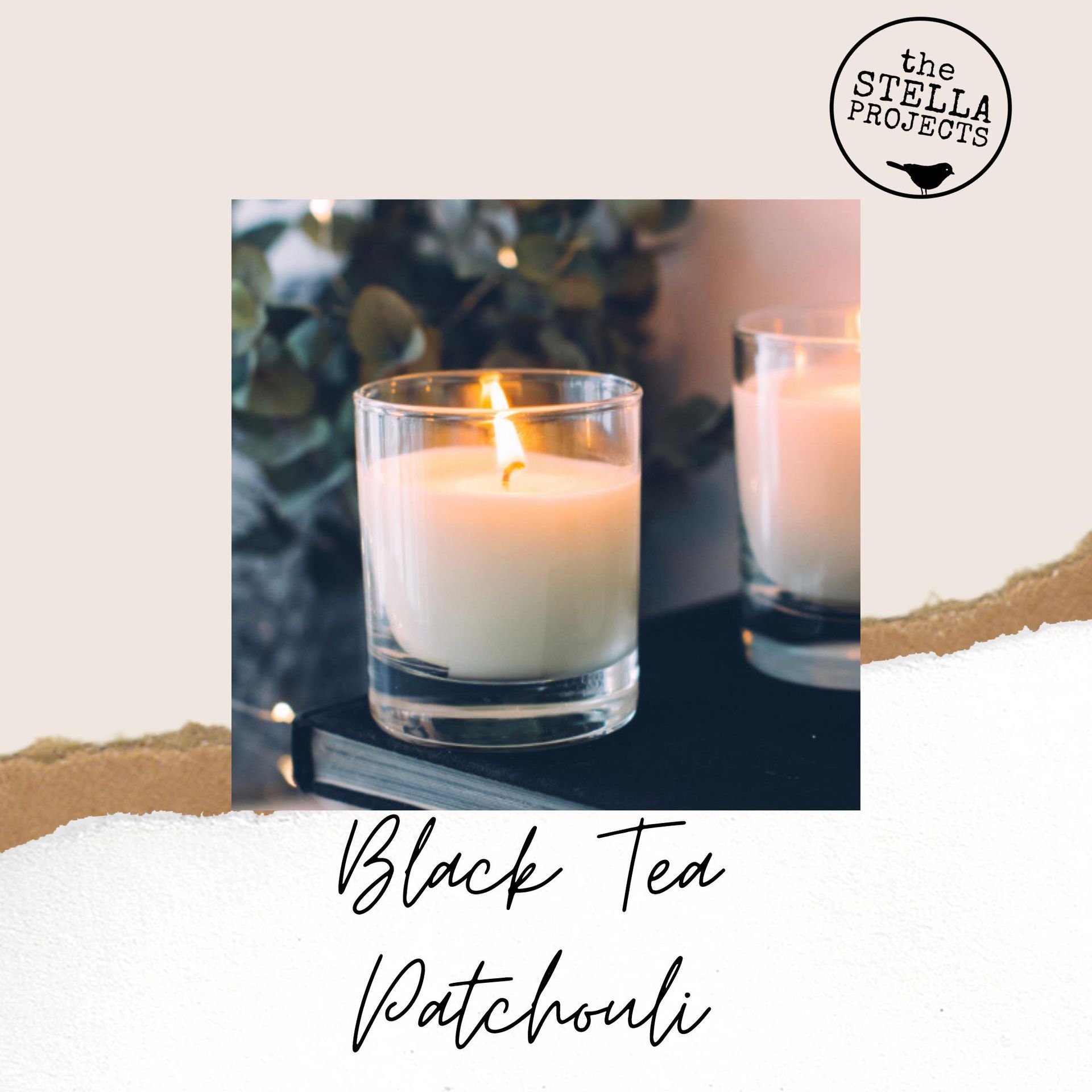 A candle is sitting on top of a book on a table.