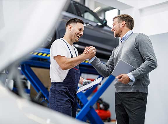 Mechanic and Man Shaking Hands — Austin, TX — Alliance Collision Centers Mechanic and Man Shaking Hands — Austin, TX — Alliance Collision Centers