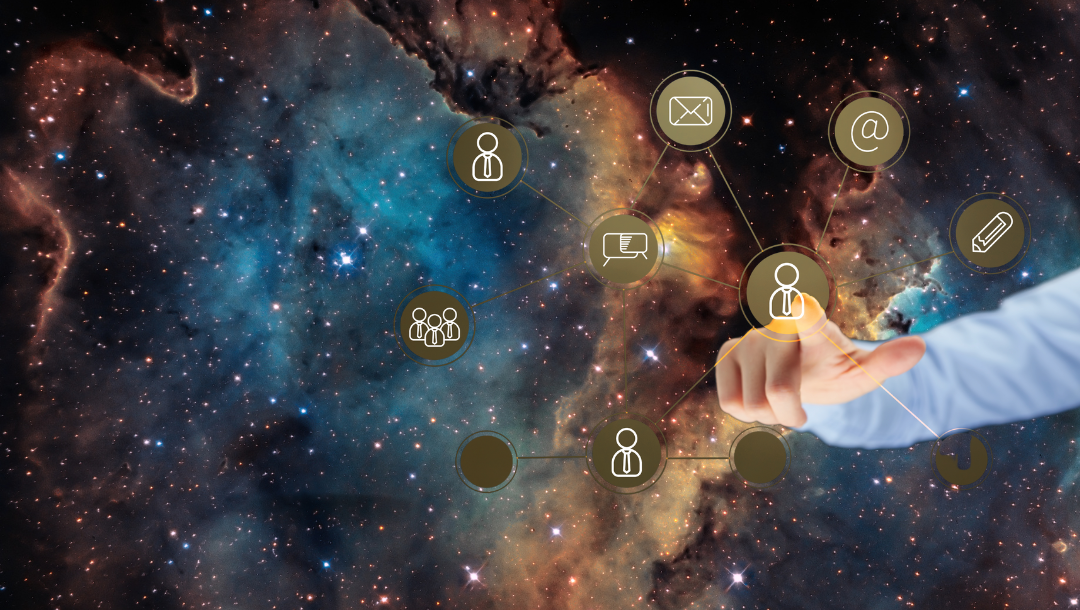 A group of people are sitting around a table in a conference room.