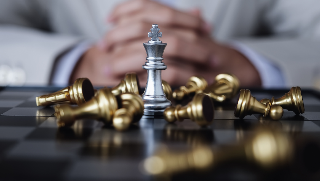 A woman is giving a presentation to a group of people in a conference room.