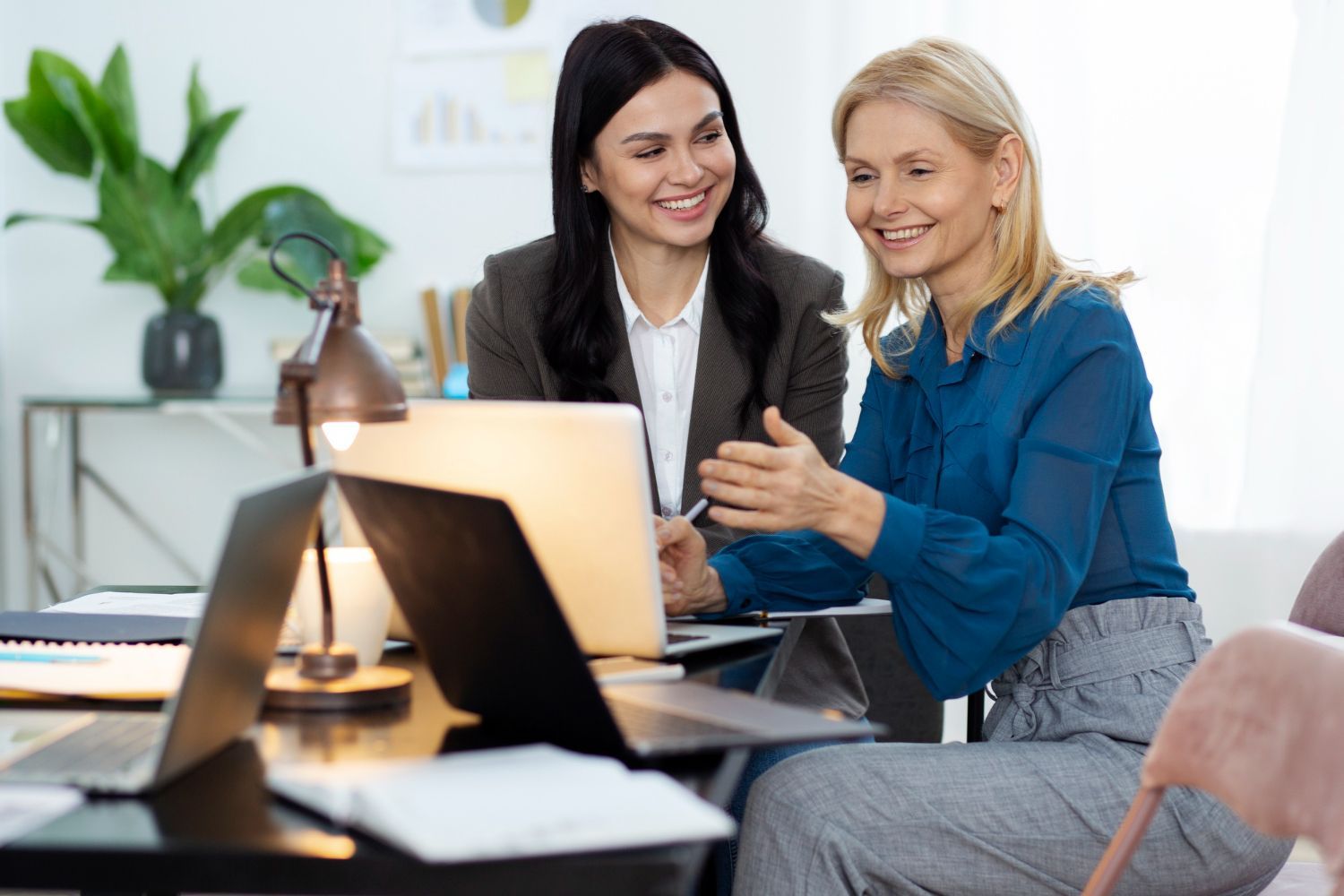Sign for Bulman Jones & Cook PLLC on a wooden board featuring a Montana outline with mountains and text.