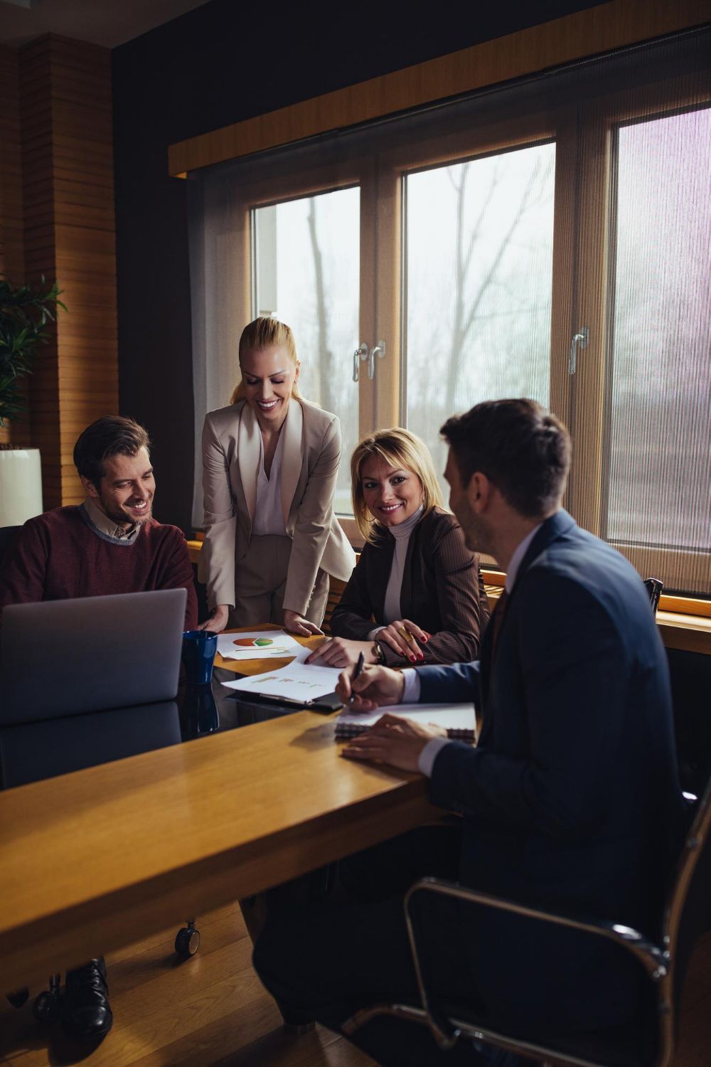 Sign for Bulman Jones & Cook PLLC on a wooden board featuring a Montana outline with mountains and text.
