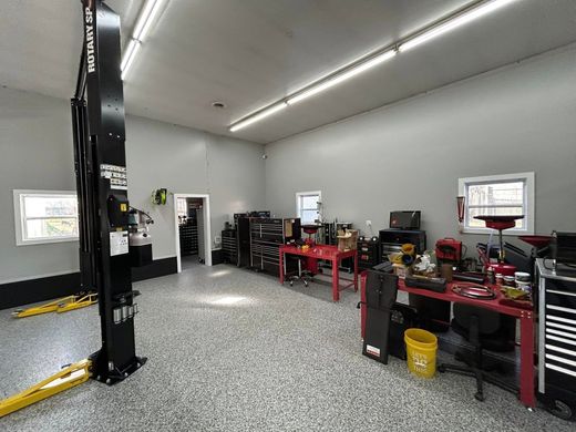 Car Lift in the Middle of the Garage | Independence Automotive Maintenance & Repair
