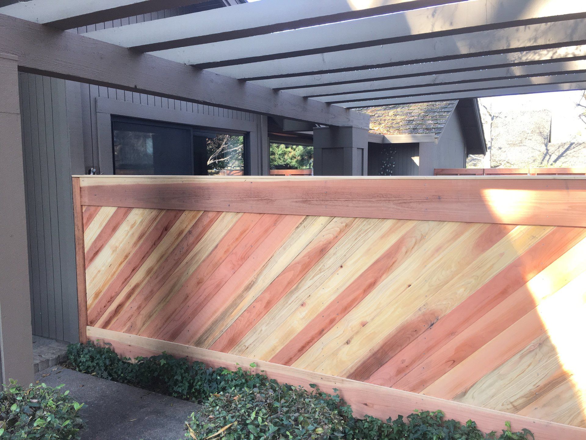 a wooden fence with a diagonal pattern on it