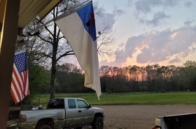 trucked parked next to flag