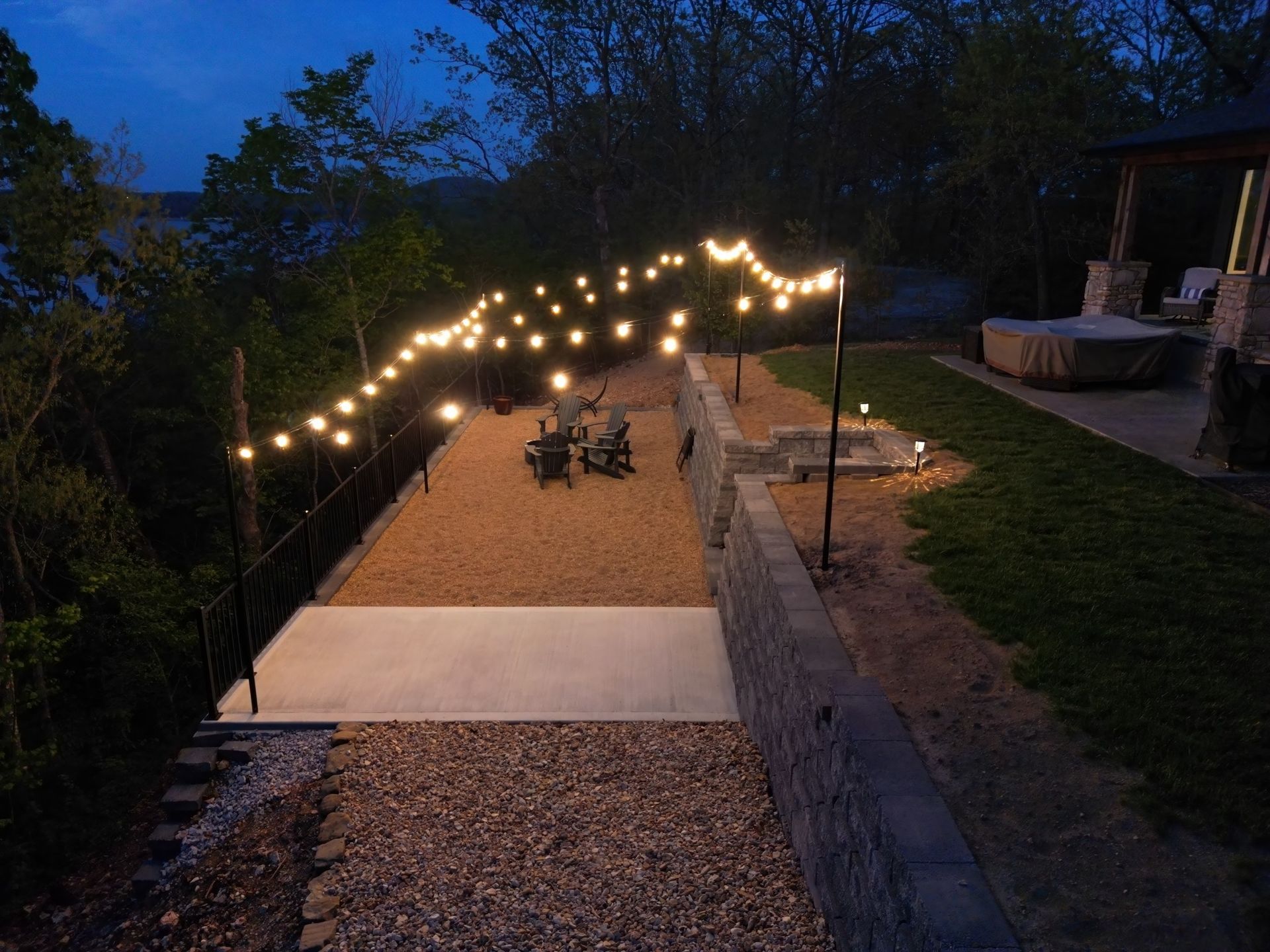 A patio with a lot of lights on it at night