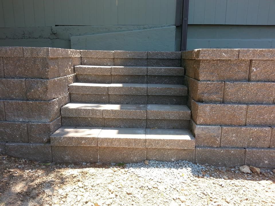 A set of stairs built into a brick wall