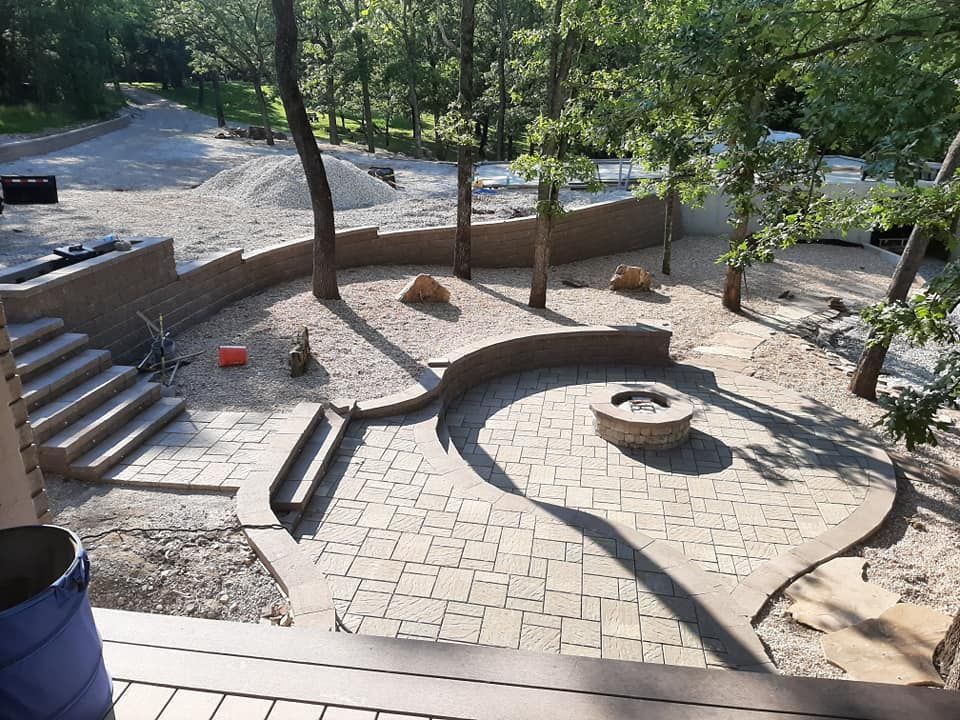 There is a fire pit in the middle of the patio.