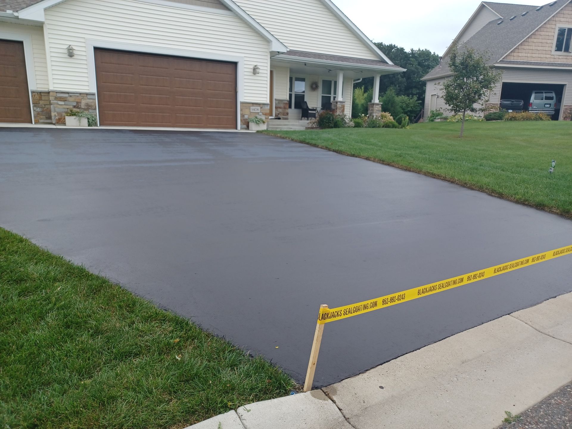 A house with a driveway that has been paved