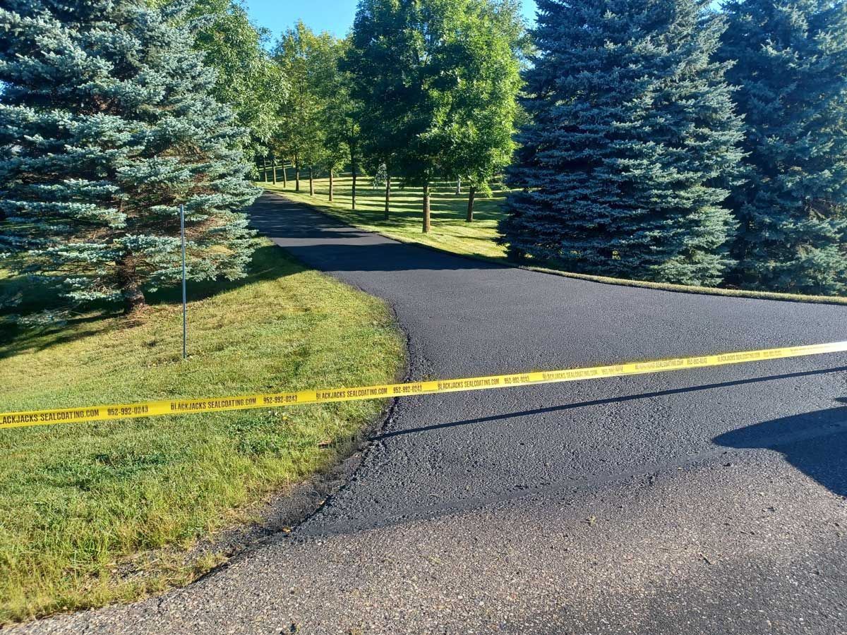 A road with a tape along the side of it.
