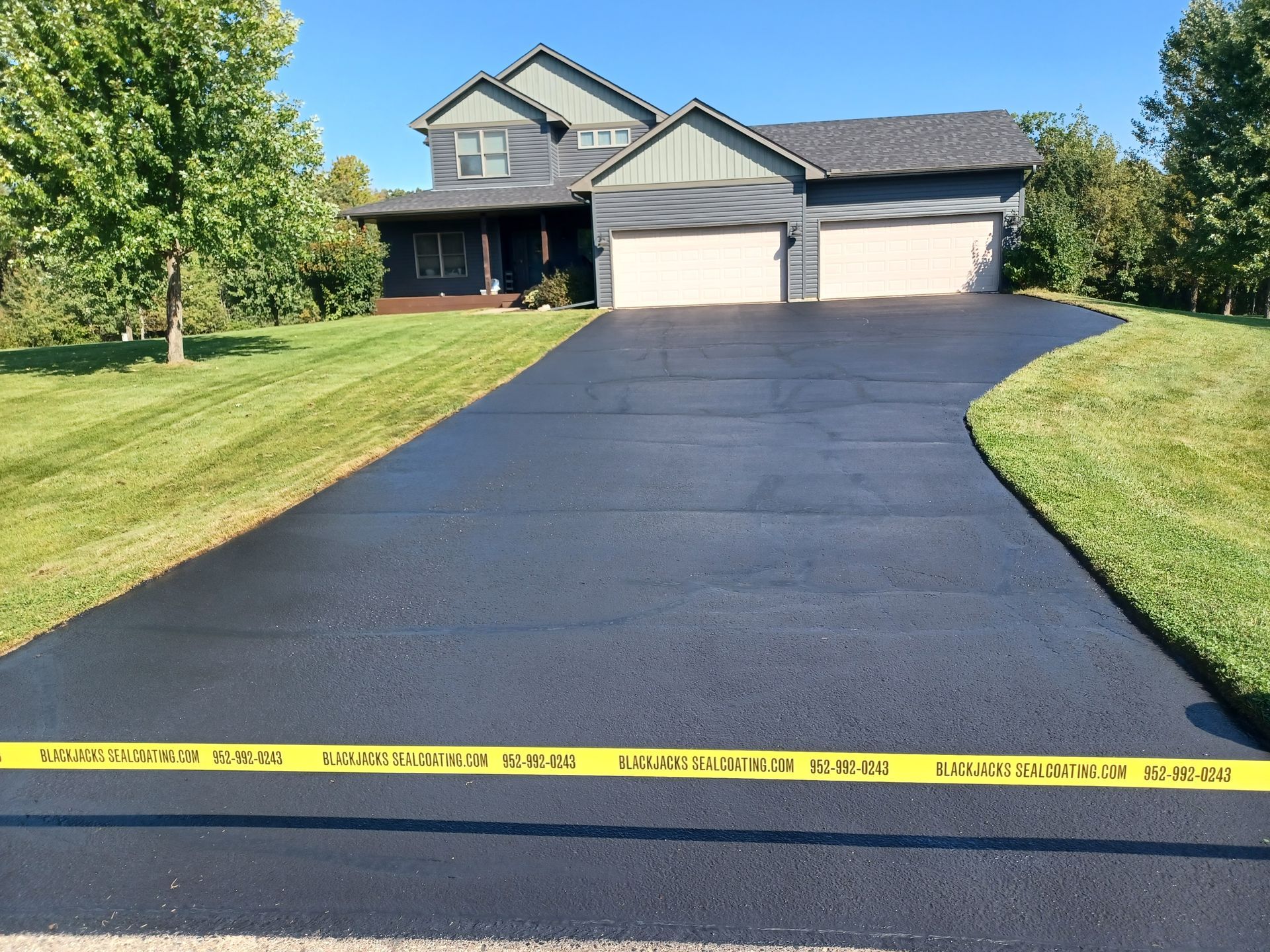 A house with a driveway that has been paved