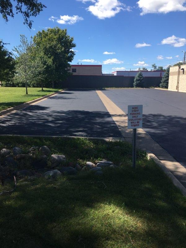 A parking lot with a sign that says no parking