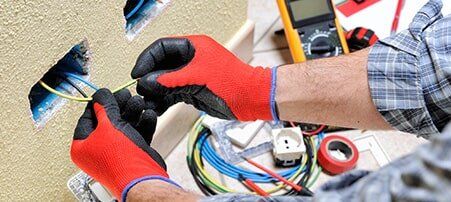 Residential Electrician — Electrician At Work With Safety Equipment in Richardson, TX