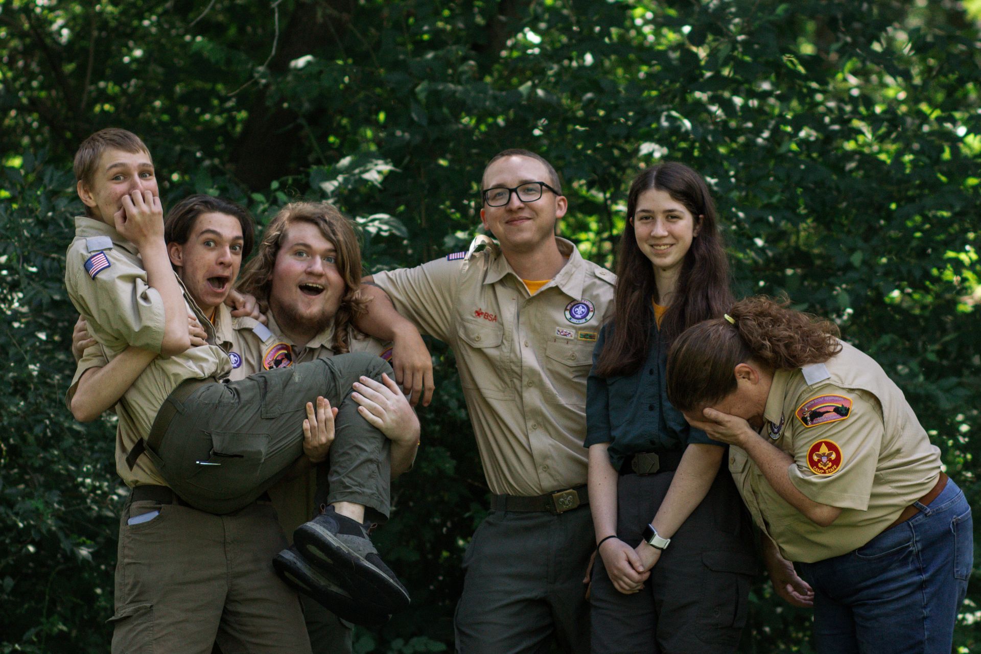 A group of boy scouts are posing for a picture.