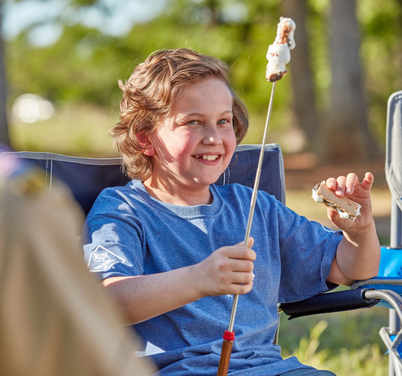 A woman holding a sign that says indians are red
