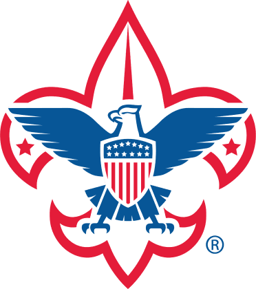 A woman wearing a red tank top and earrings is smiling